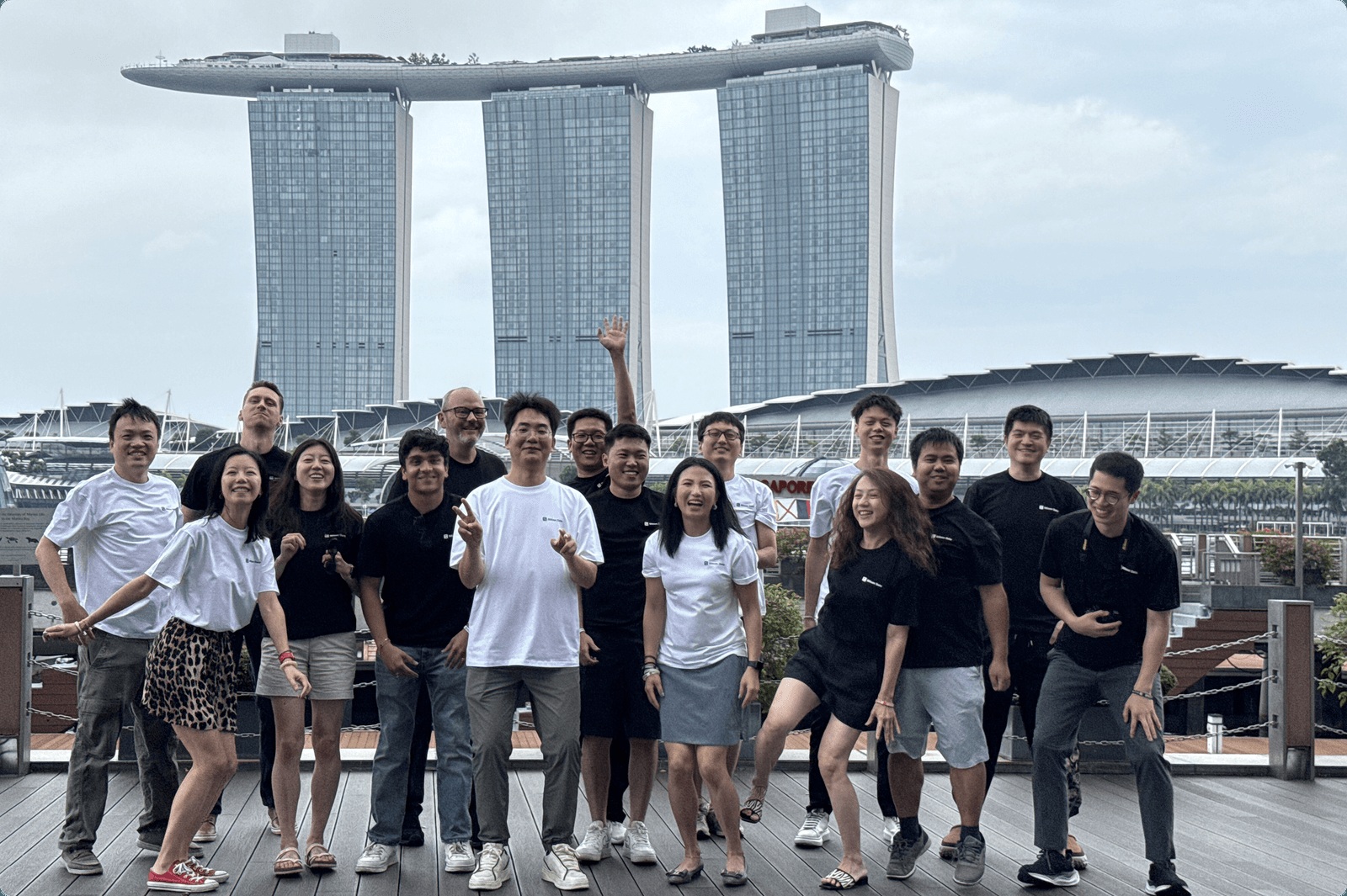 Silicon Data team posing beside Singapore’s Marina Bay, with Marina Bay Sands behind them