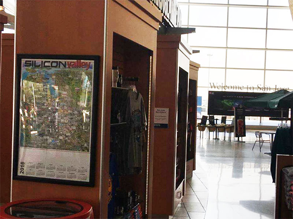 A Silicon Valley map calendar displayed beside an airport shop in San Jose