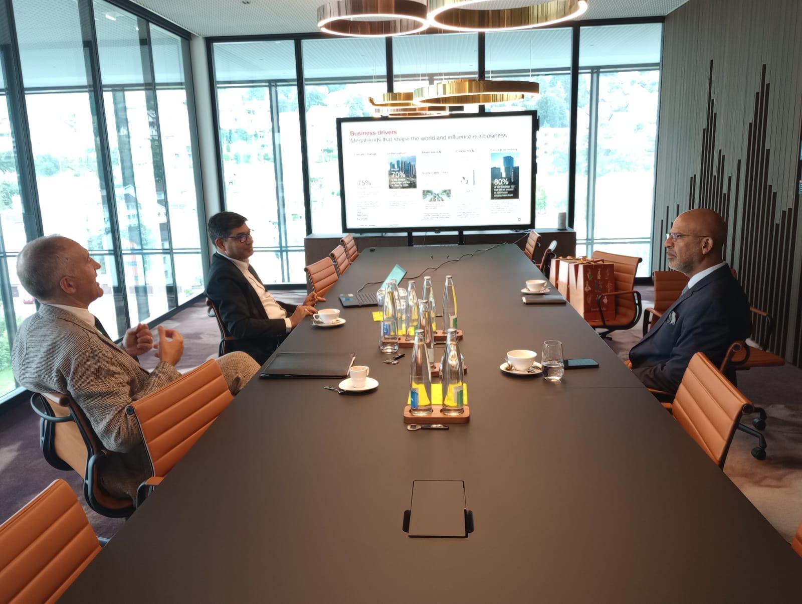Napoli and Ambassador Mridul Kumar in discussion across a conference table