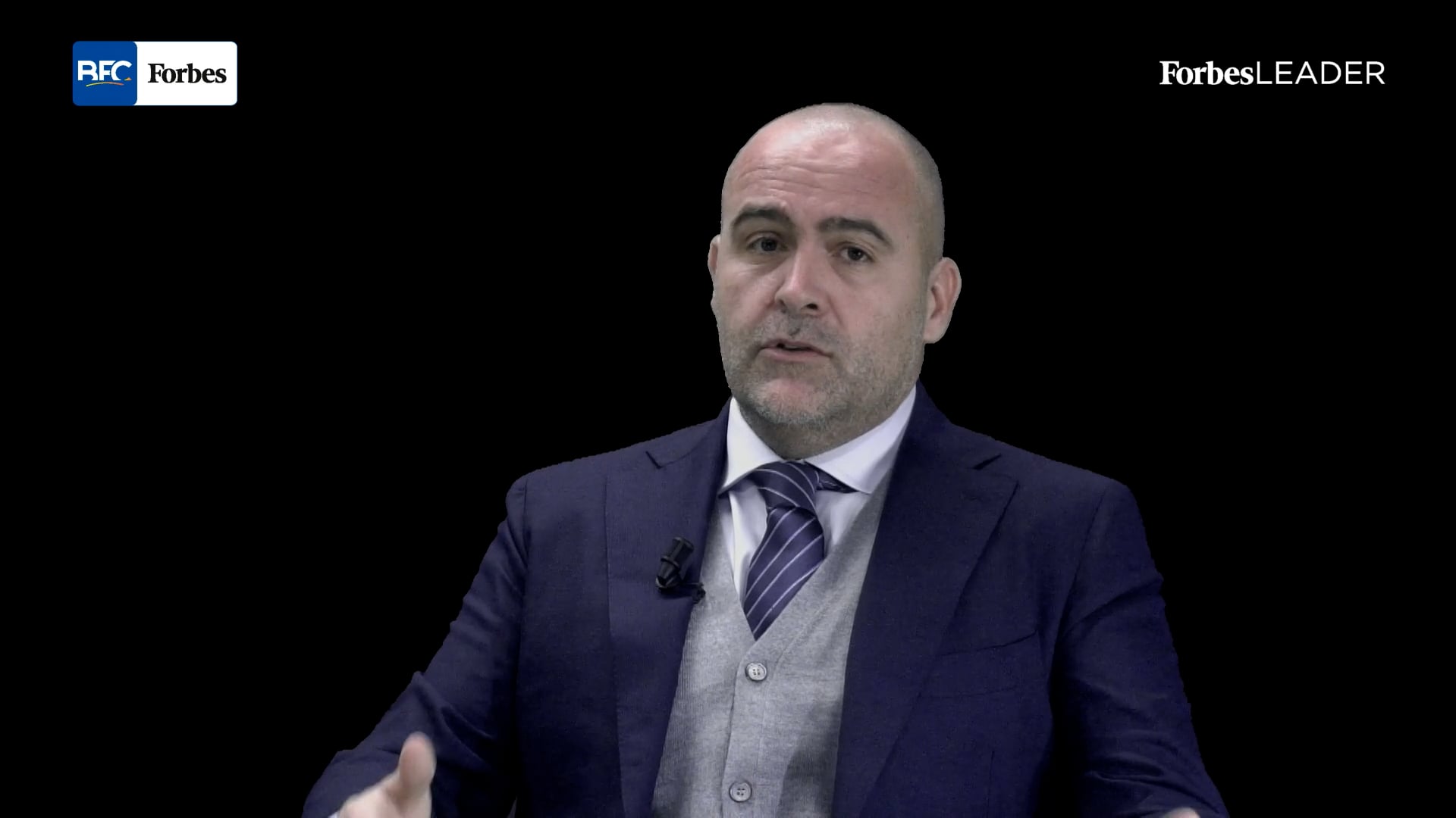 Simone Mazzuca speaking in a suit during his Forbes Leader studio interview