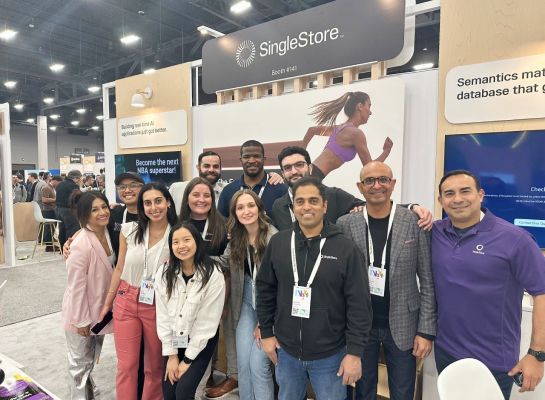 SingleStore colleagues gathered at a company exhibition booth