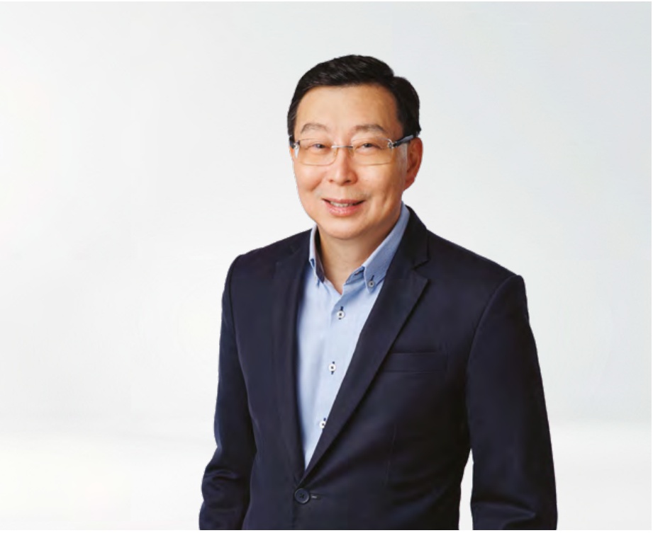 Bill Chang, chief executive of Singtel Digital InfraCo, in a dark jacket and blue shirt