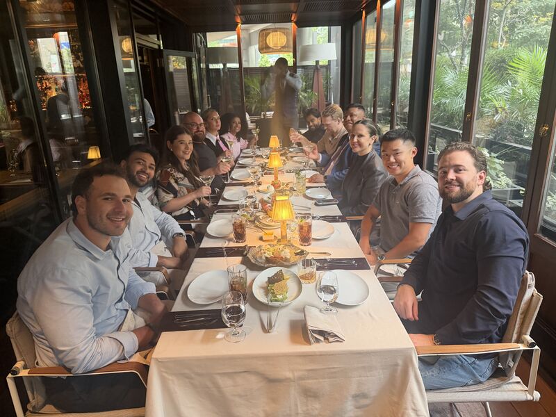 Salesforce ecosystem colleagues gathered around a long restaurant table during Conscendo’s Toronto visit