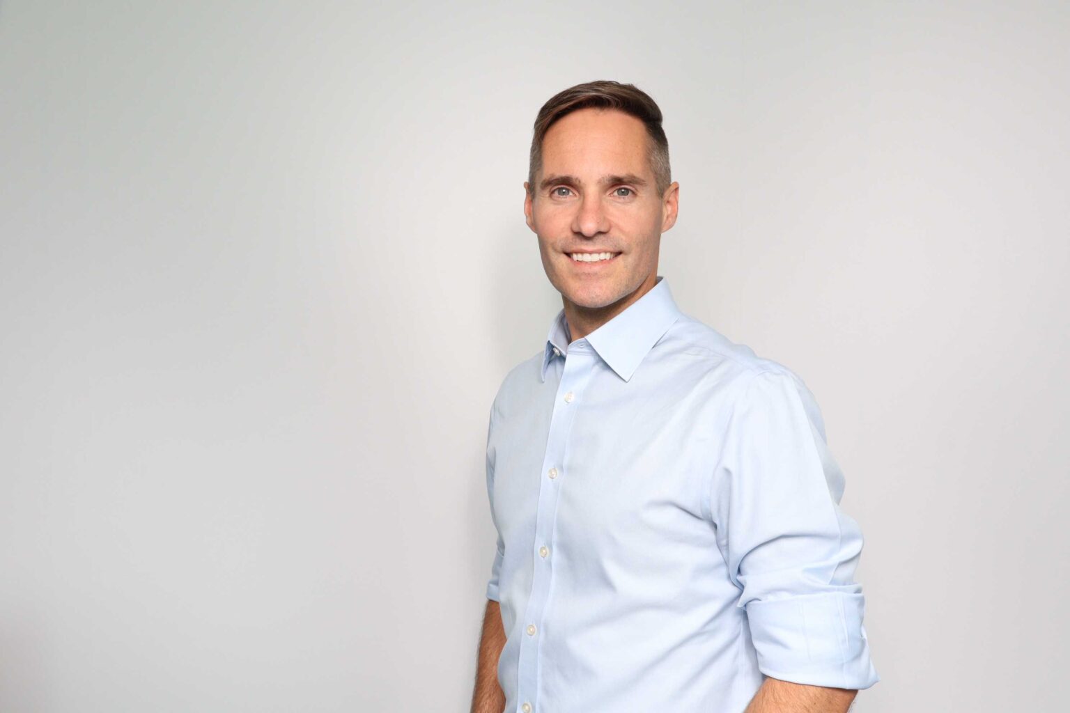 Skin Analytics founder Neil Daly in a pale blue shirt