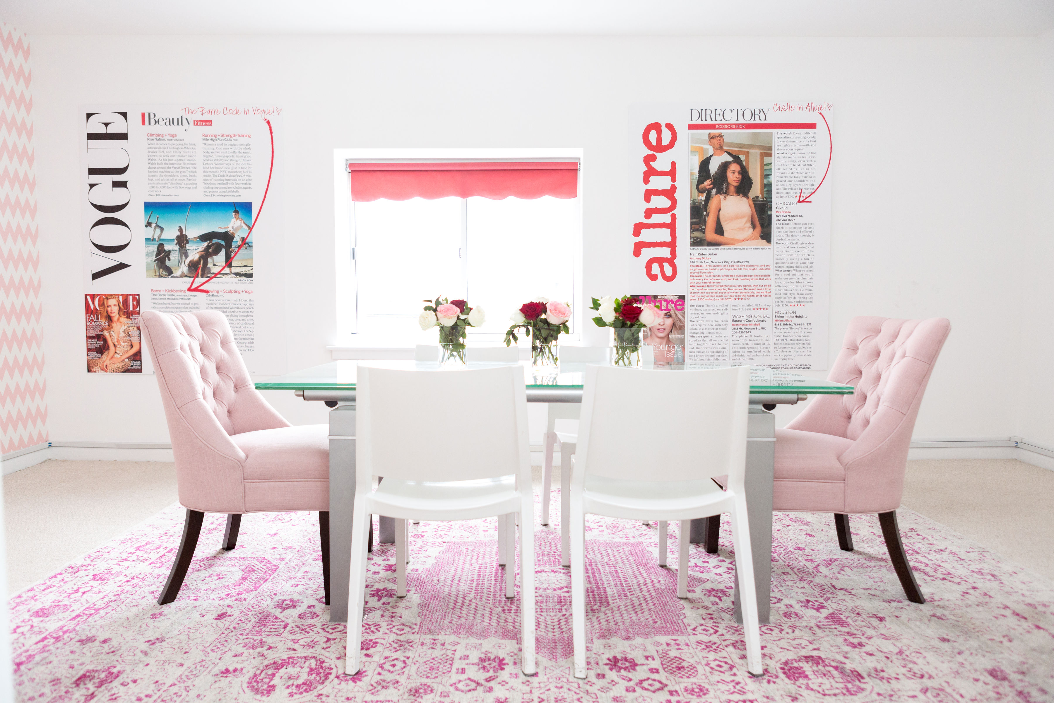 A bright Skirt PR office conference room with pale pink chairs, a pink rug, flowers and magazine pages on the wall