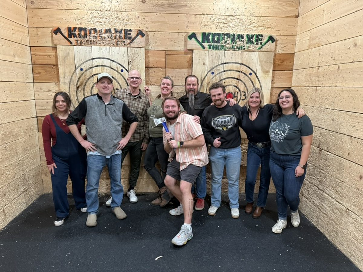 Sky Peak Technologies team members at an axe-throwing outing