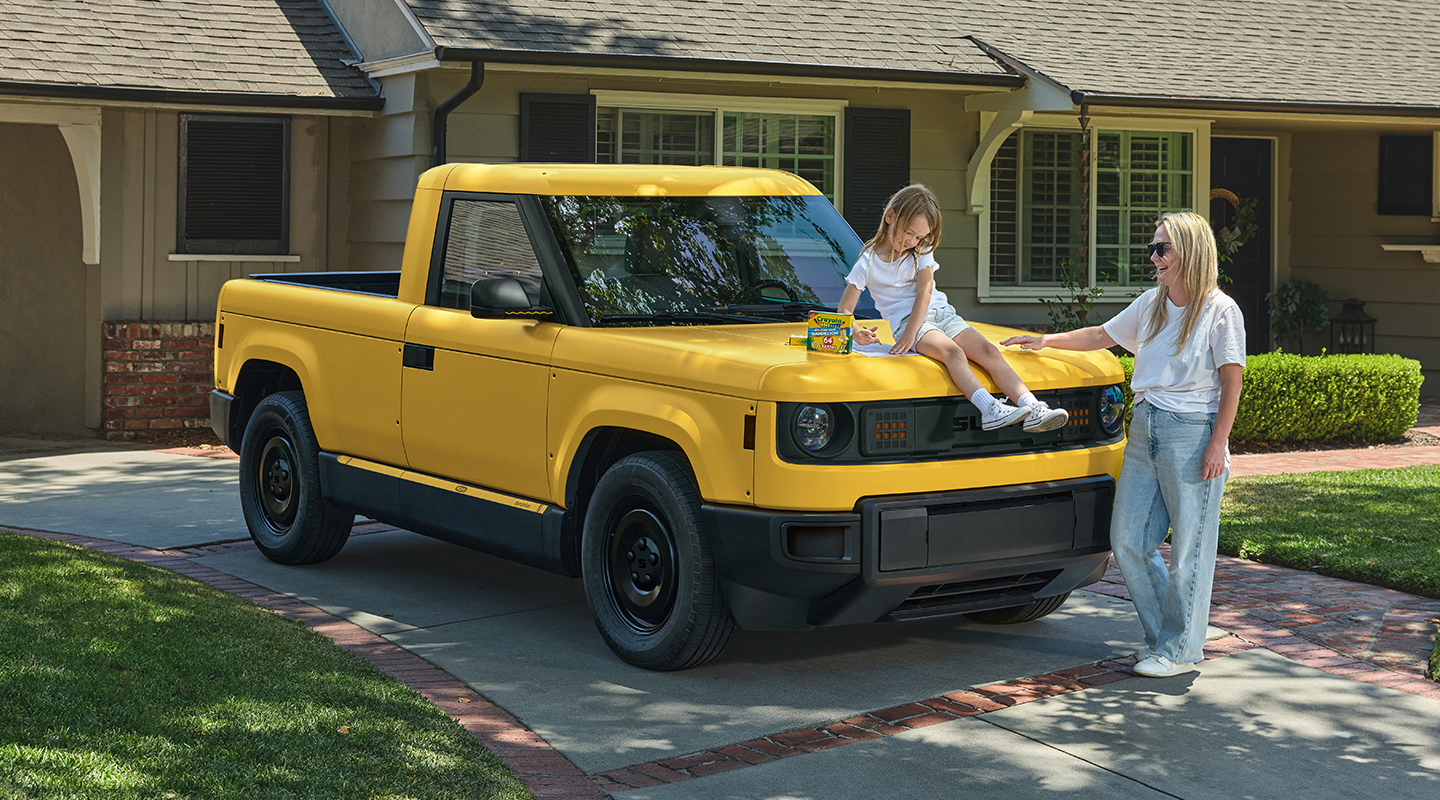 Brightly wrapped Slate trucks in Crayola colors arranged in a playful studio scene