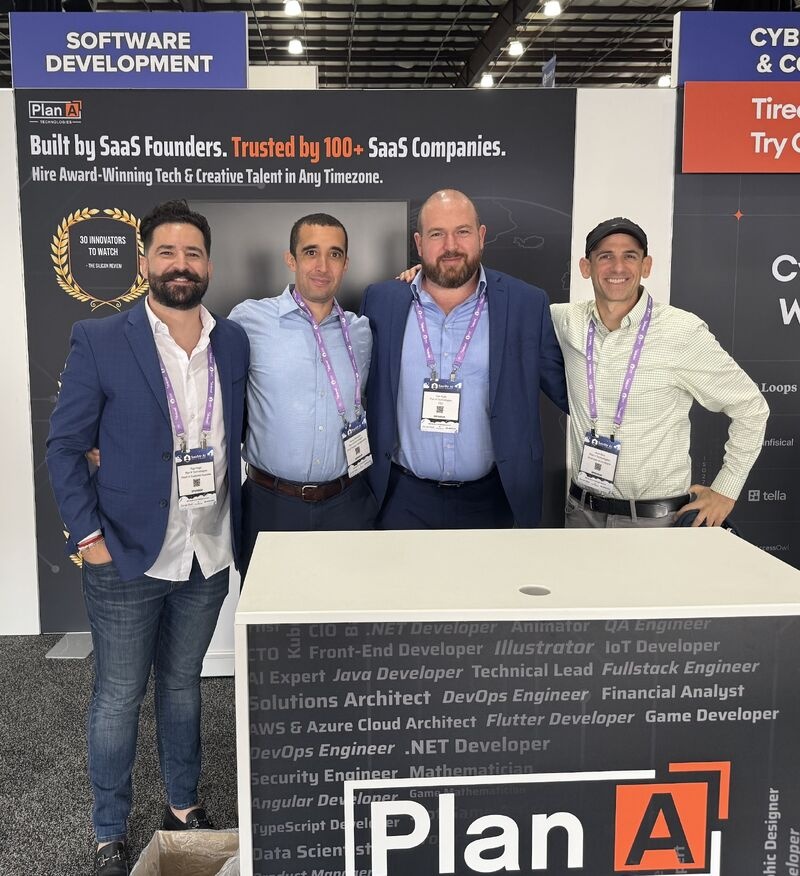 Slav Kulik, third from left, with three colleagues at the Plan A Technologies SaaStr 2025 booth