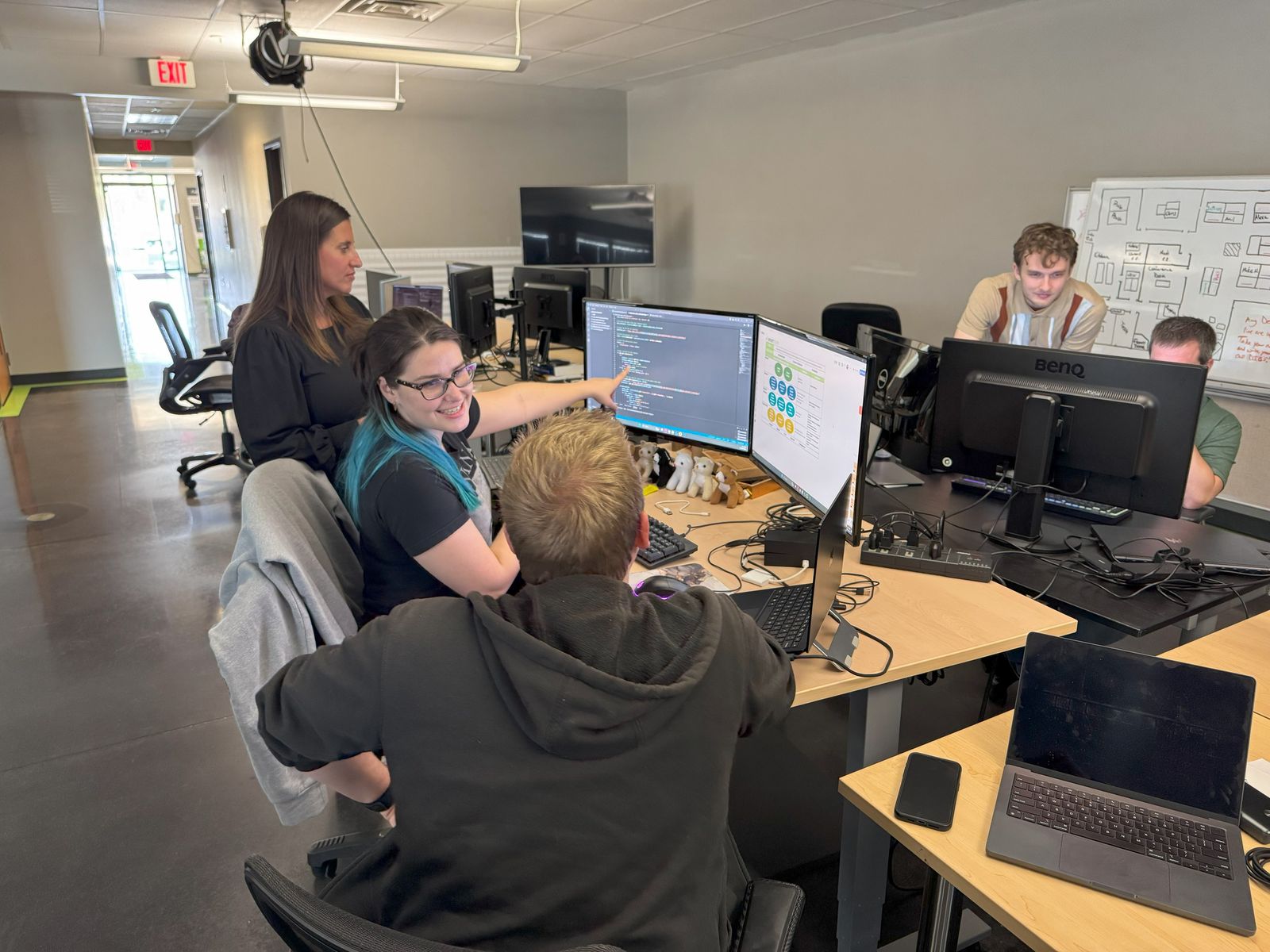 Smart Data engineers reviewing code together in the Dayton office