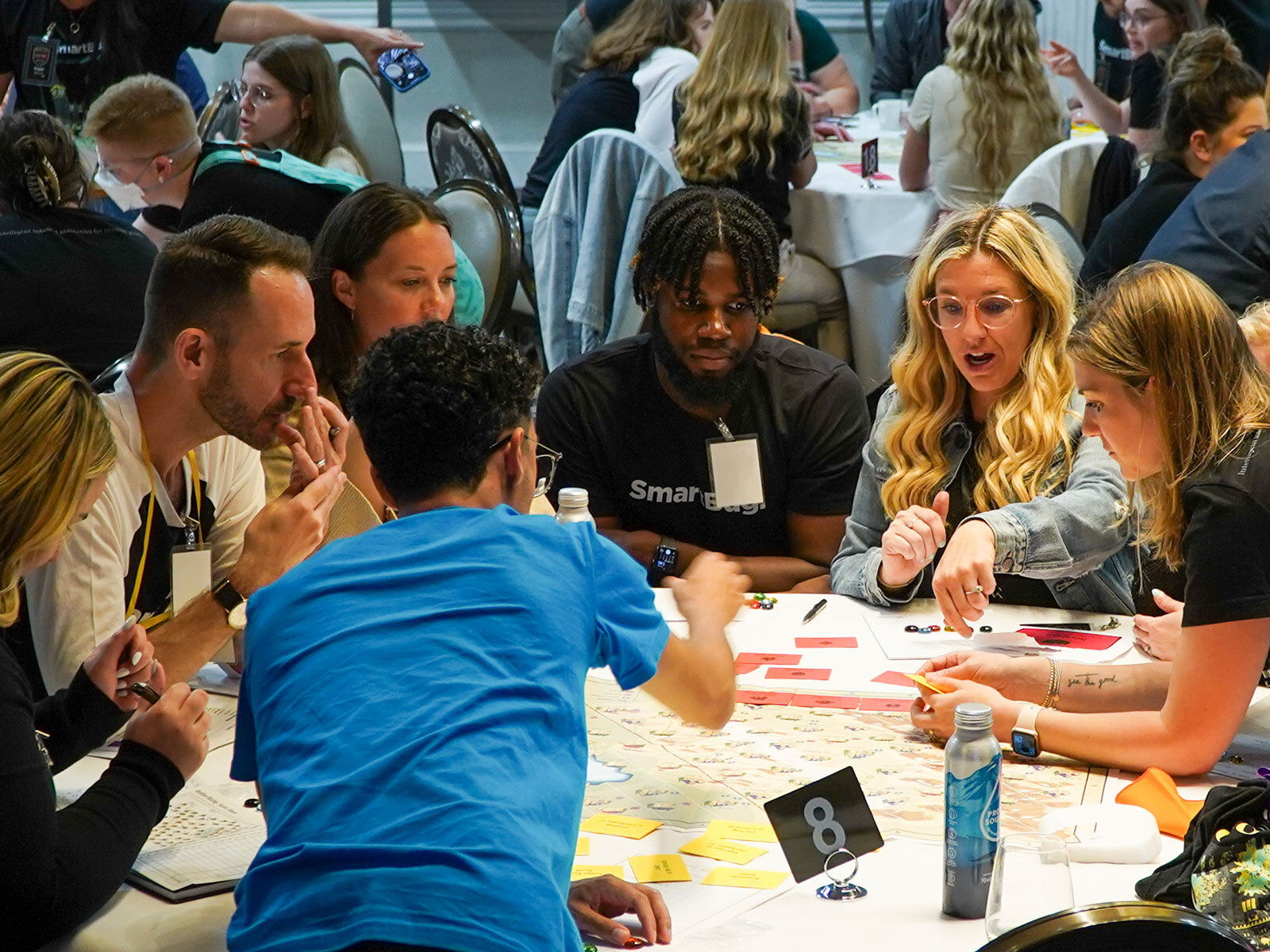 SmartBug colleagues playing a tabletop strategy game