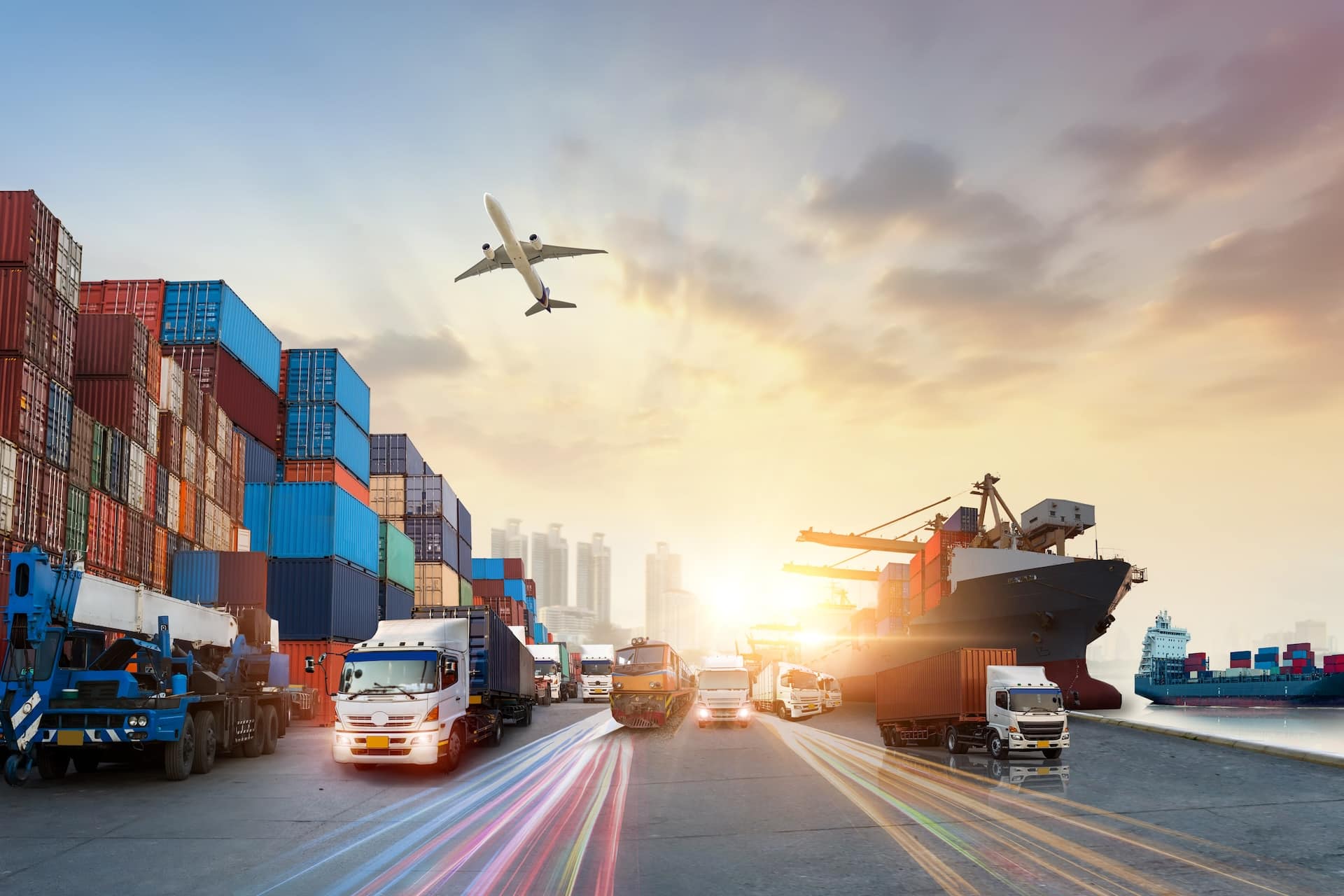 Composite transportation scene with trucks, ship, aircraft and train