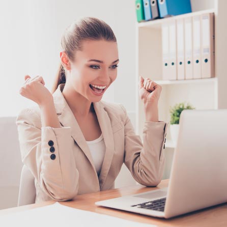 SMS StreamLine marketing photograph of a woman at a laptop