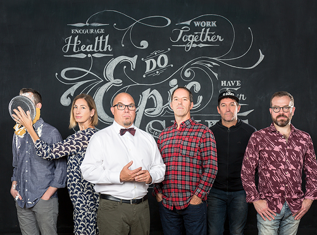 Sockeye team standing in front of a chalkboard reading Do Epic Shit