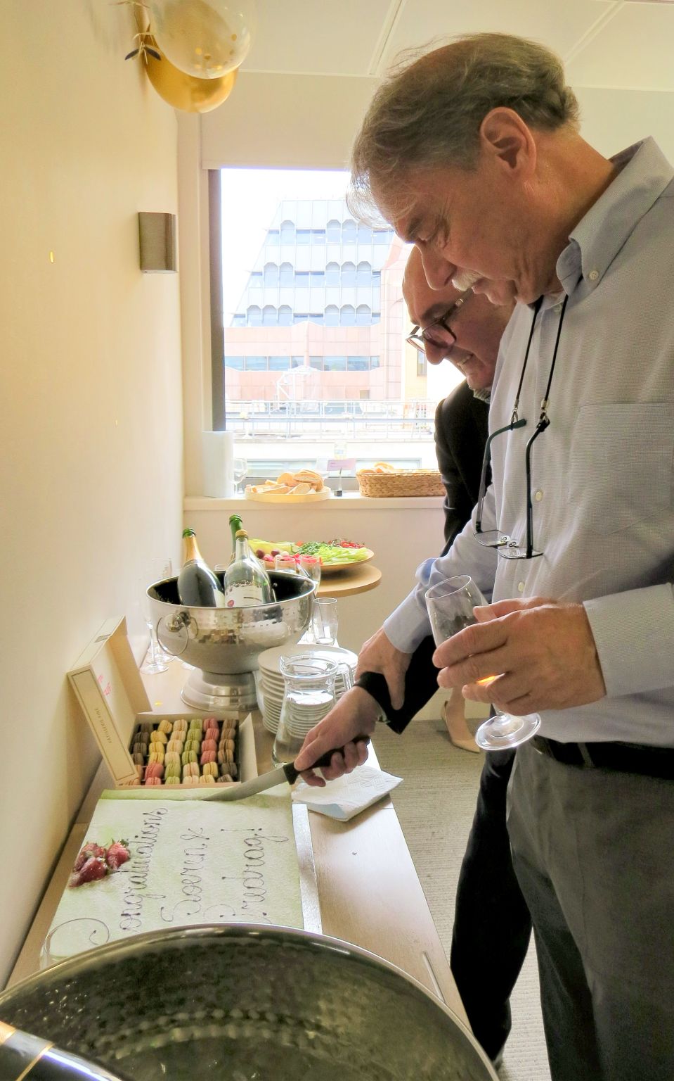 The founders cutting a congratulatory cake at Fincore’s 2023 celebration