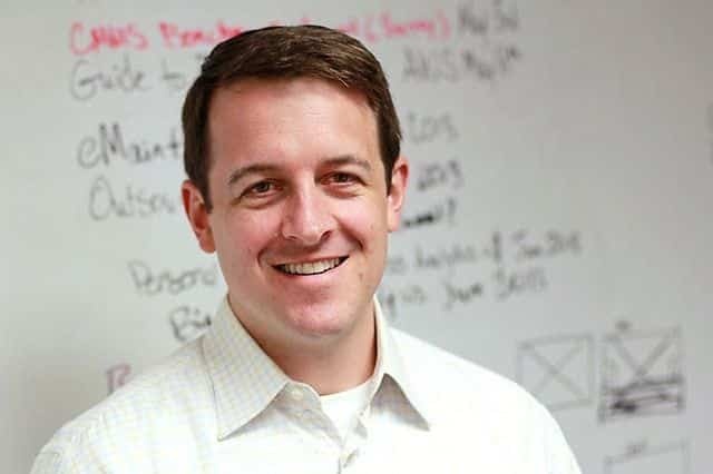 Software Advice co-founder Don Fornes standing in front of a whiteboard