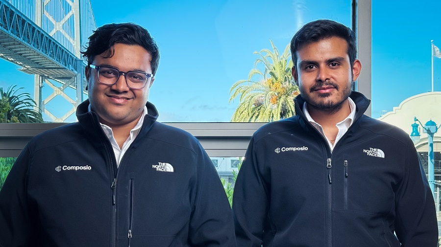 Composio co-founders Soham Ganatra and Karan Vaidya wearing company jackets
