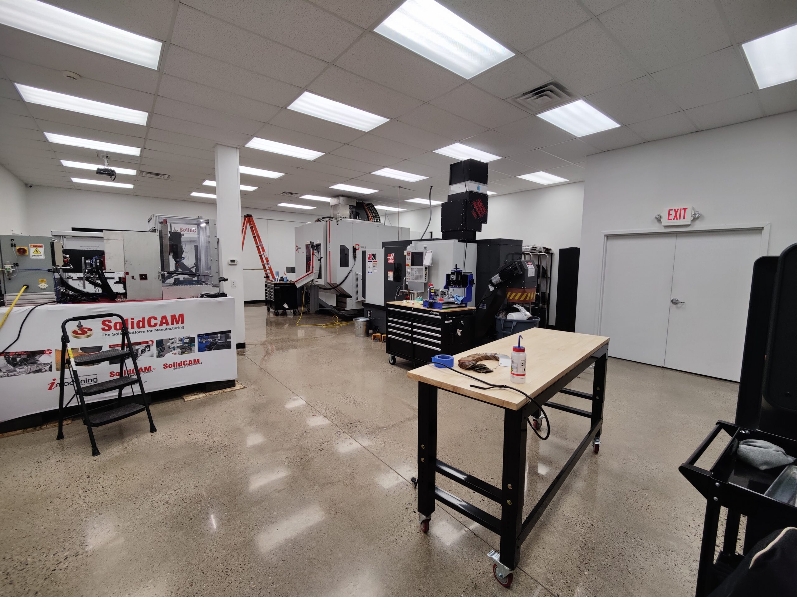 CNC machines and workbenches inside SolidCAM’s U.S. technology center