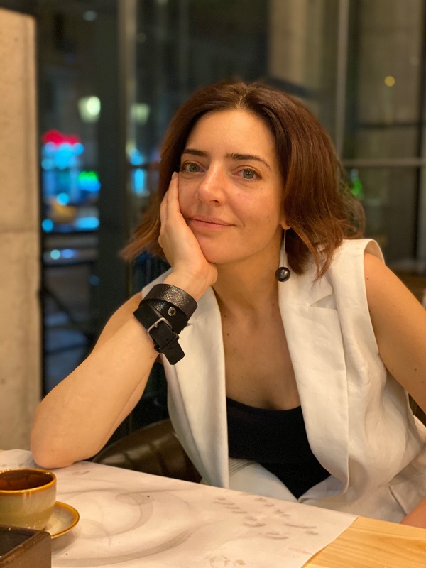 Sololearn co-founder Yeva Hyusyan seated at a table