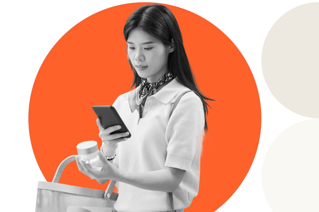 Optum promotional visual of a shopper checking her phone while holding a product