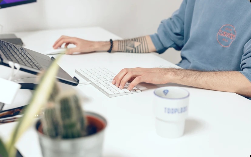 A person working at a desk in a workplace image published by Solvd