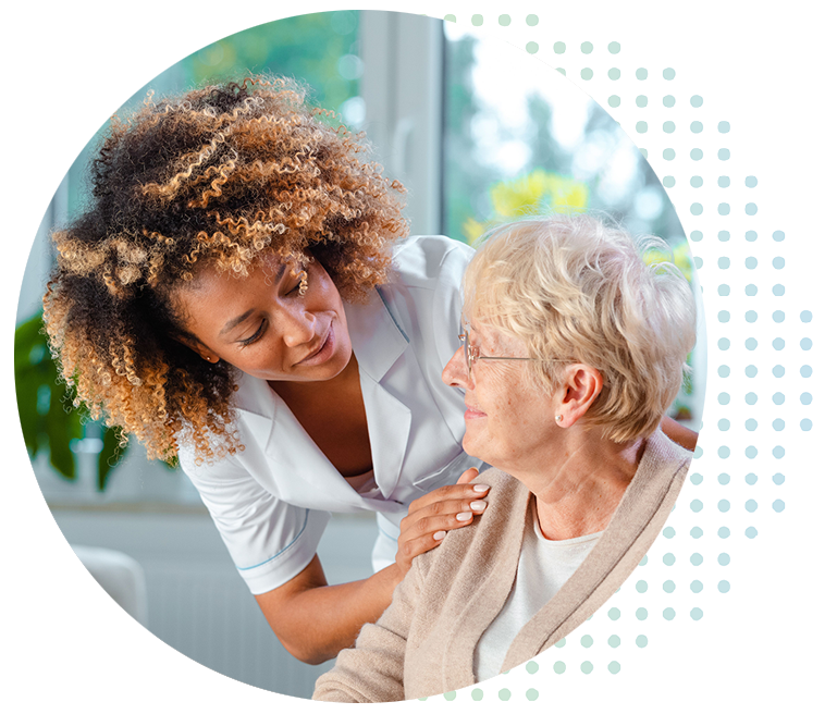 A clinician speaking with a patient during a home visit