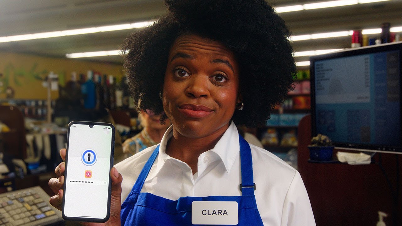 Actor playing Clara holds a phone in a grocery store during a 1Password campaign by Something Massive