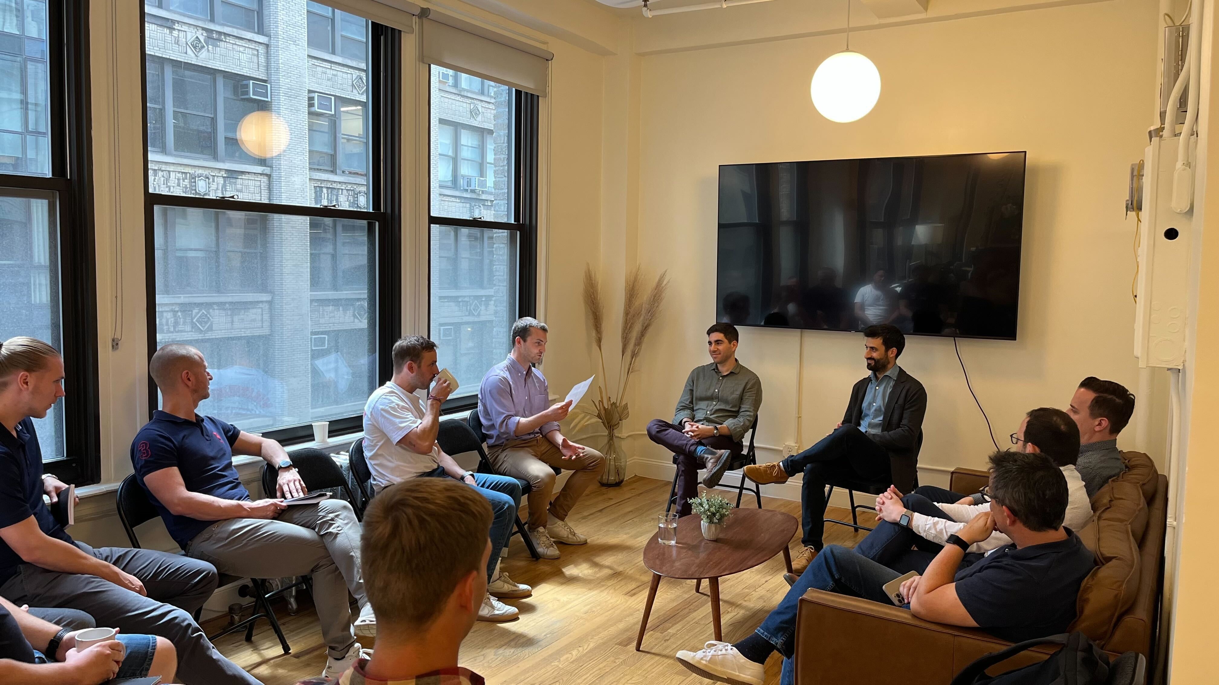 Czech startup participants seated in a circle during a founder discussion at SOSA in New York