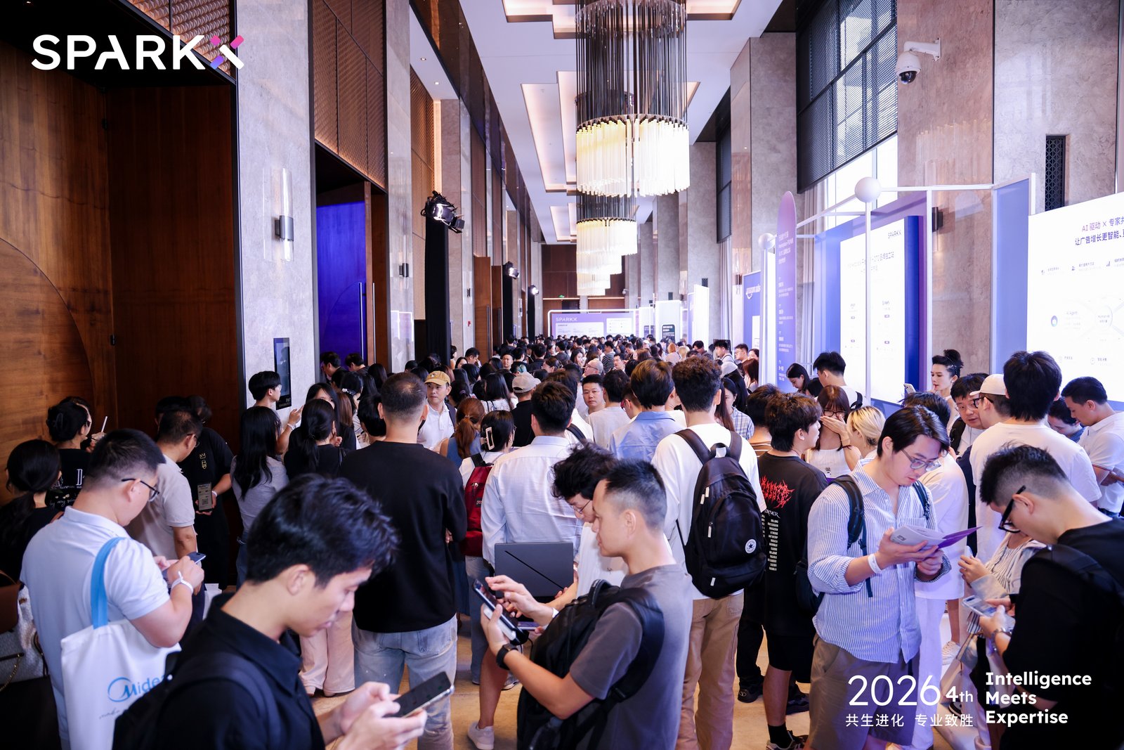 Attendees talking in the lobby at SparkX’s 2024 AI marketing summit