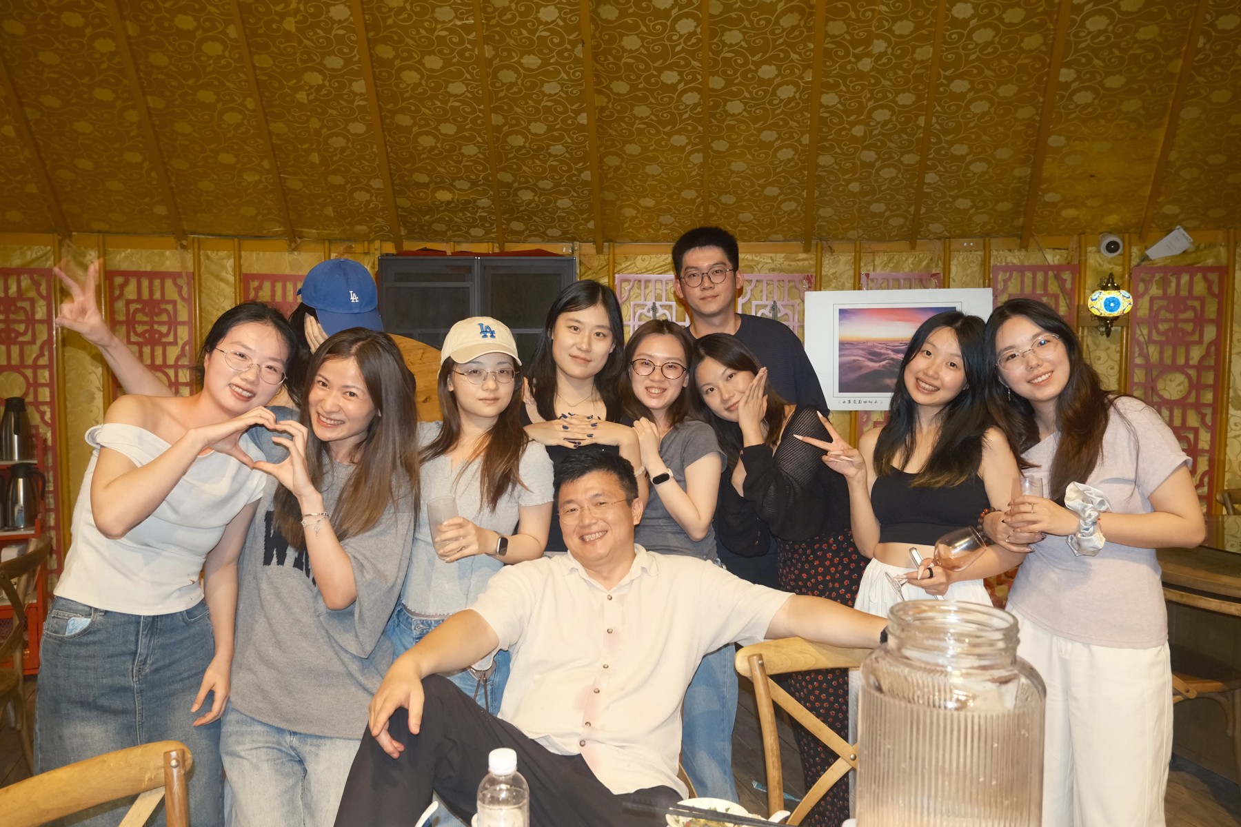SparkX colleagues posing together at a social gathering