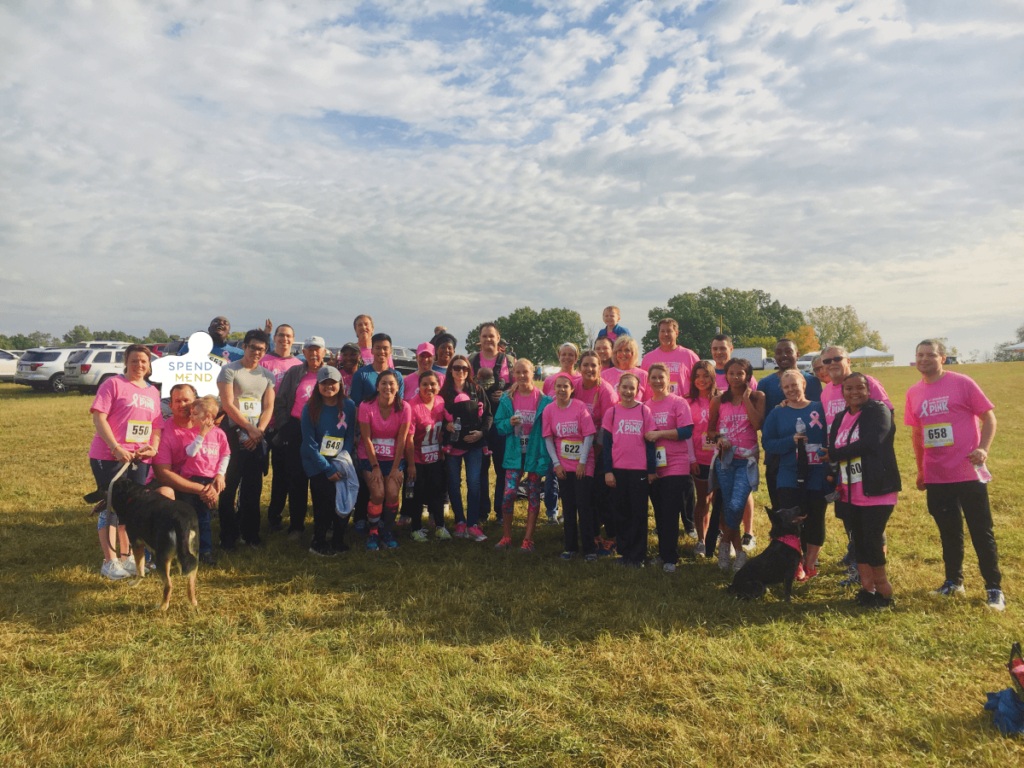 SpendMend colleagues gathered outdoors at a Bee Brave 5K event