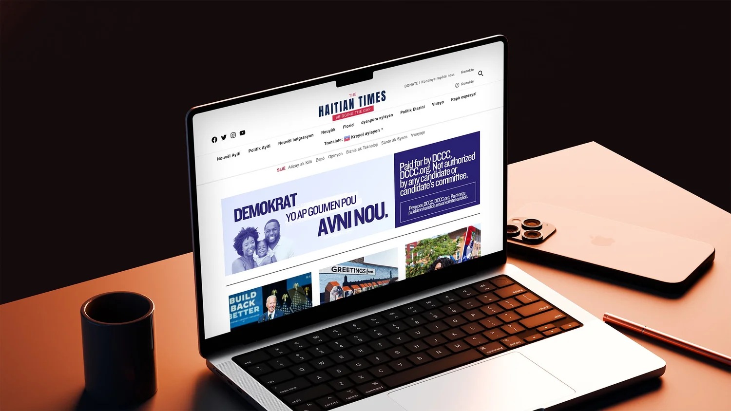 Laptop showing a Haitian Creole DCCC advertisement on The Haitian Times website