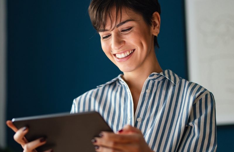 A learner looking at a tablet in imagery from Sponge’s Tesco case study