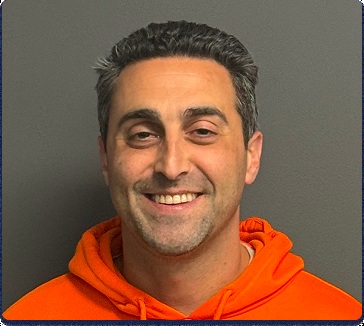 Matt Manocherian, CEO of Sports Info Solutions, wearing an orange hoodie