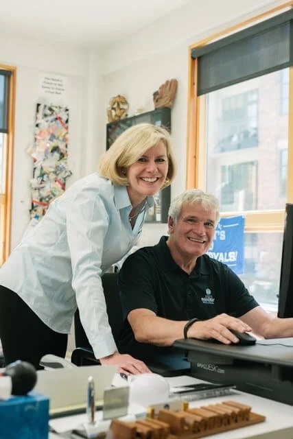 Lynn and Liz Lashbrook working together in their Portland office