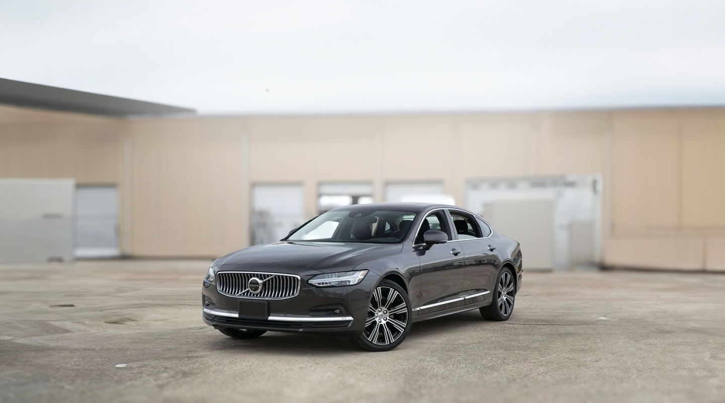 Spyne product demonstration showing a gray Volvo photographed on an outdoor lot