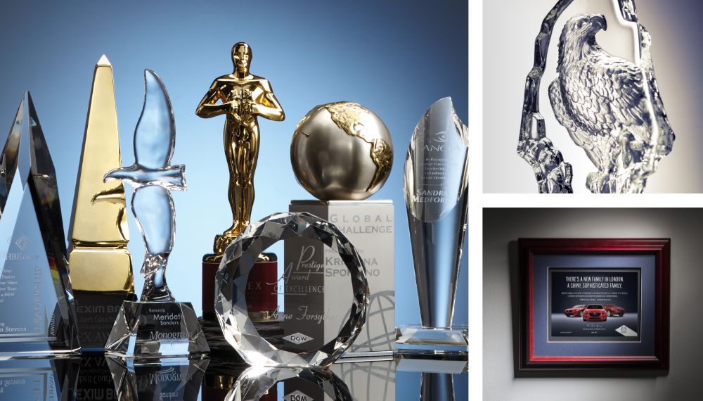 A collection of crystal, glass and metal recognition awards made by SRG