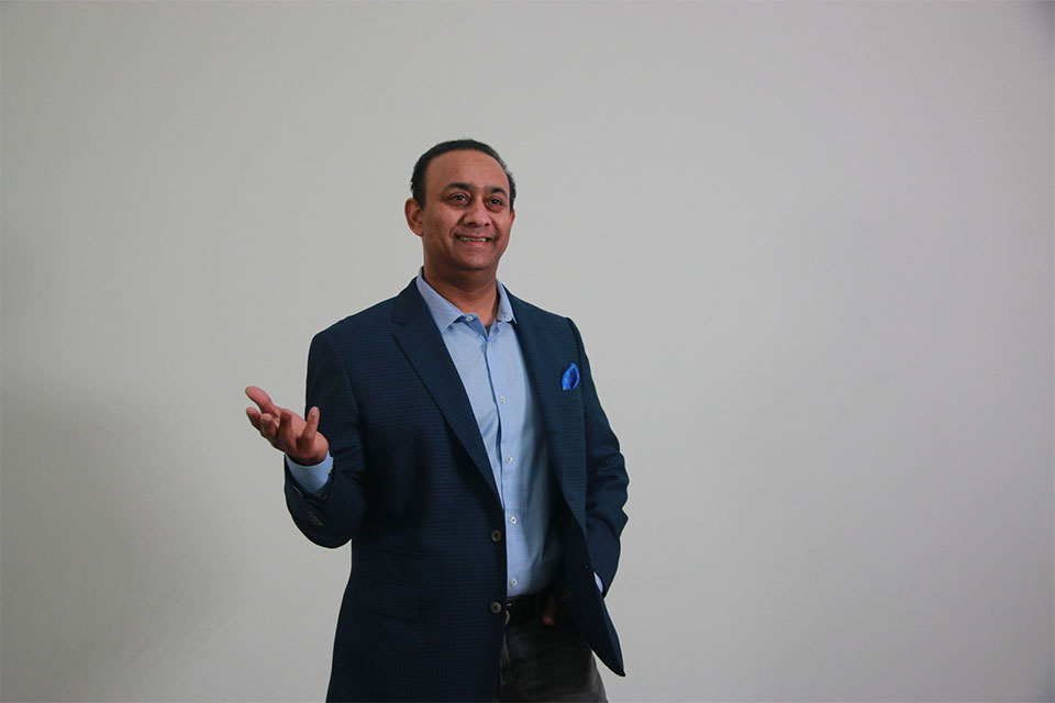 Srikanth Gaddam standing with one hand extended in a conversational gesture