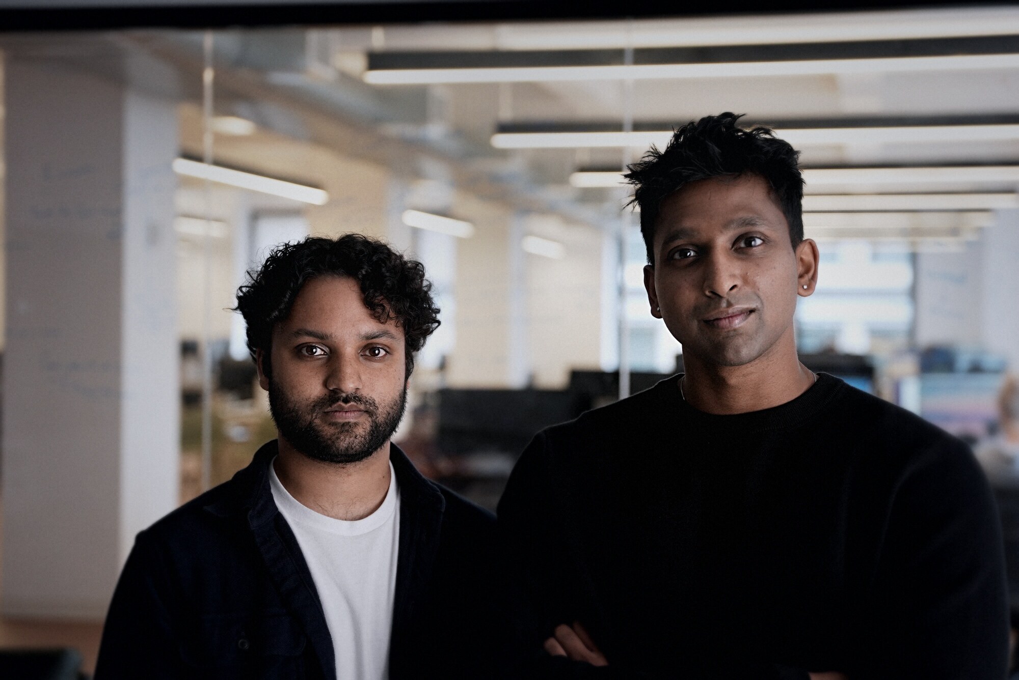 Rishabh Jain, left, and Sriram Somasundaram standing together at the Latent office
