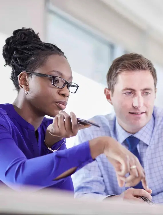 Two financial-services professionals collaborating at a desk