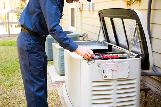 A technician in Petro’s promotional photograph checks a standby generator beside a house