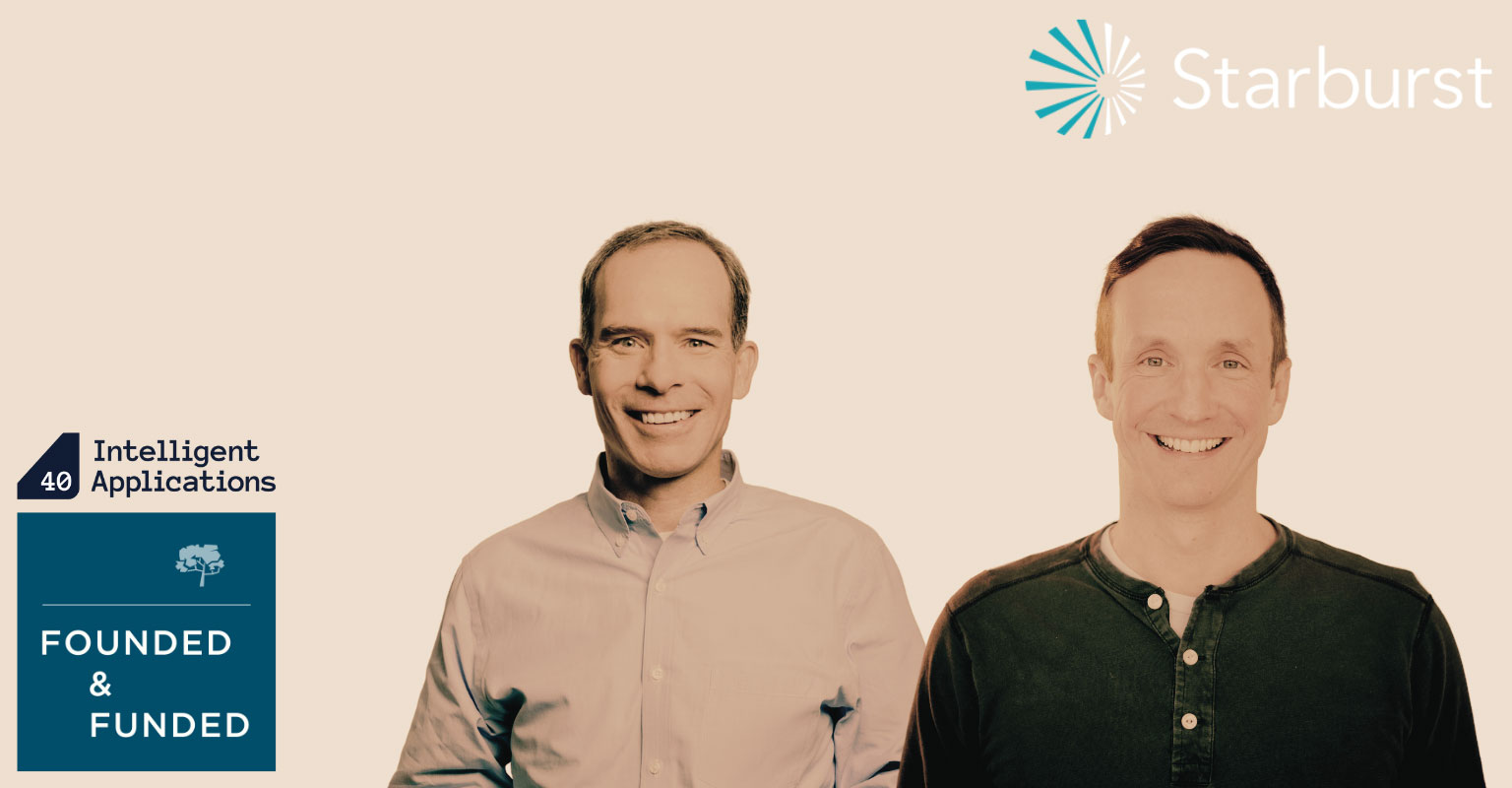 Starburst co-founder and CEO Justin Borgman standing beside a Madrona representative at an Intelligent Applications event