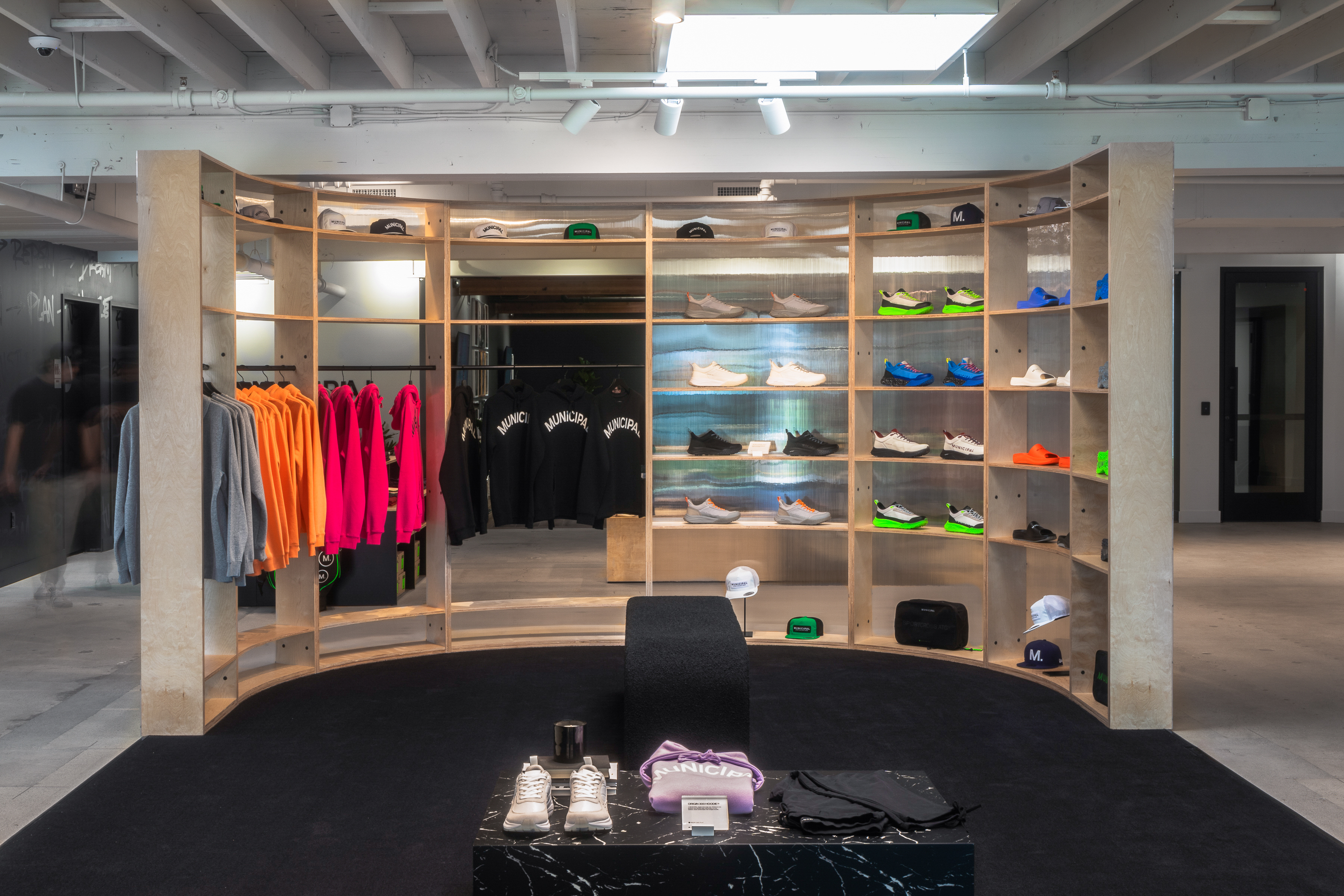 MUNICIPAL flagship retail interior with custom fixtures and a central display