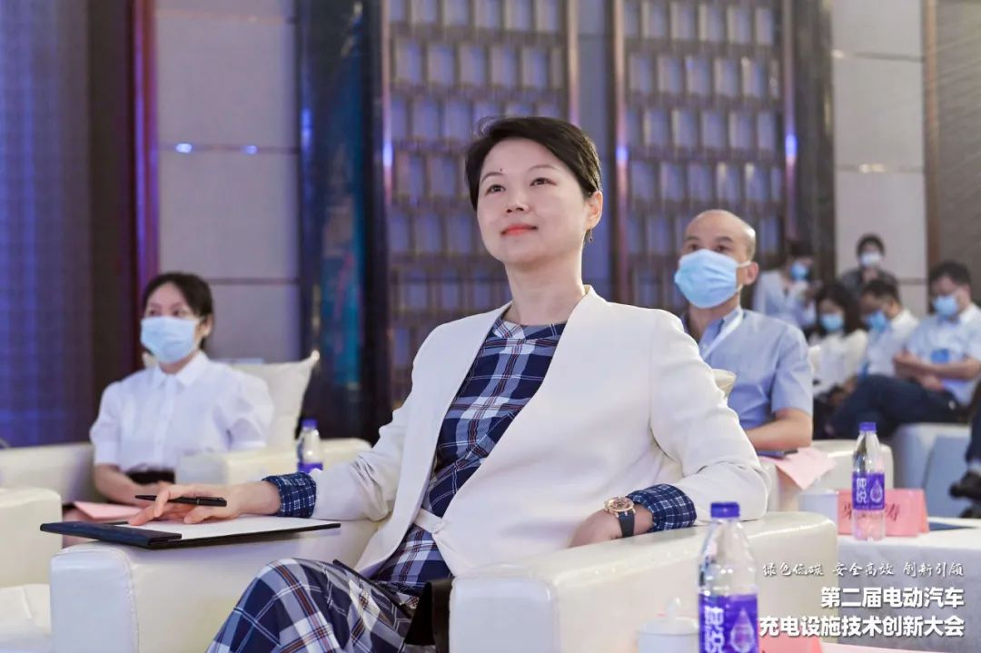 StarCharge founder Shao Danwei seated at an EV charging technology conference