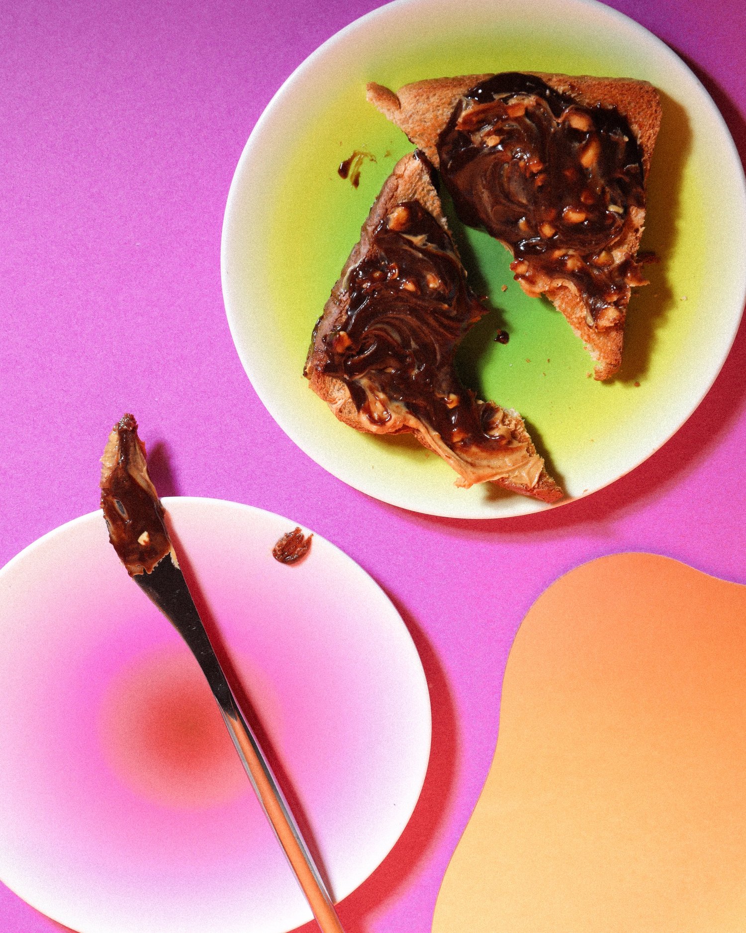 Toast covered with Gooey chocolate hazelnut spread in a colorful product photograph