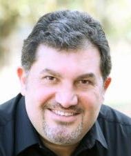 Historical portrait of Starmount co-founder Joe Halloum