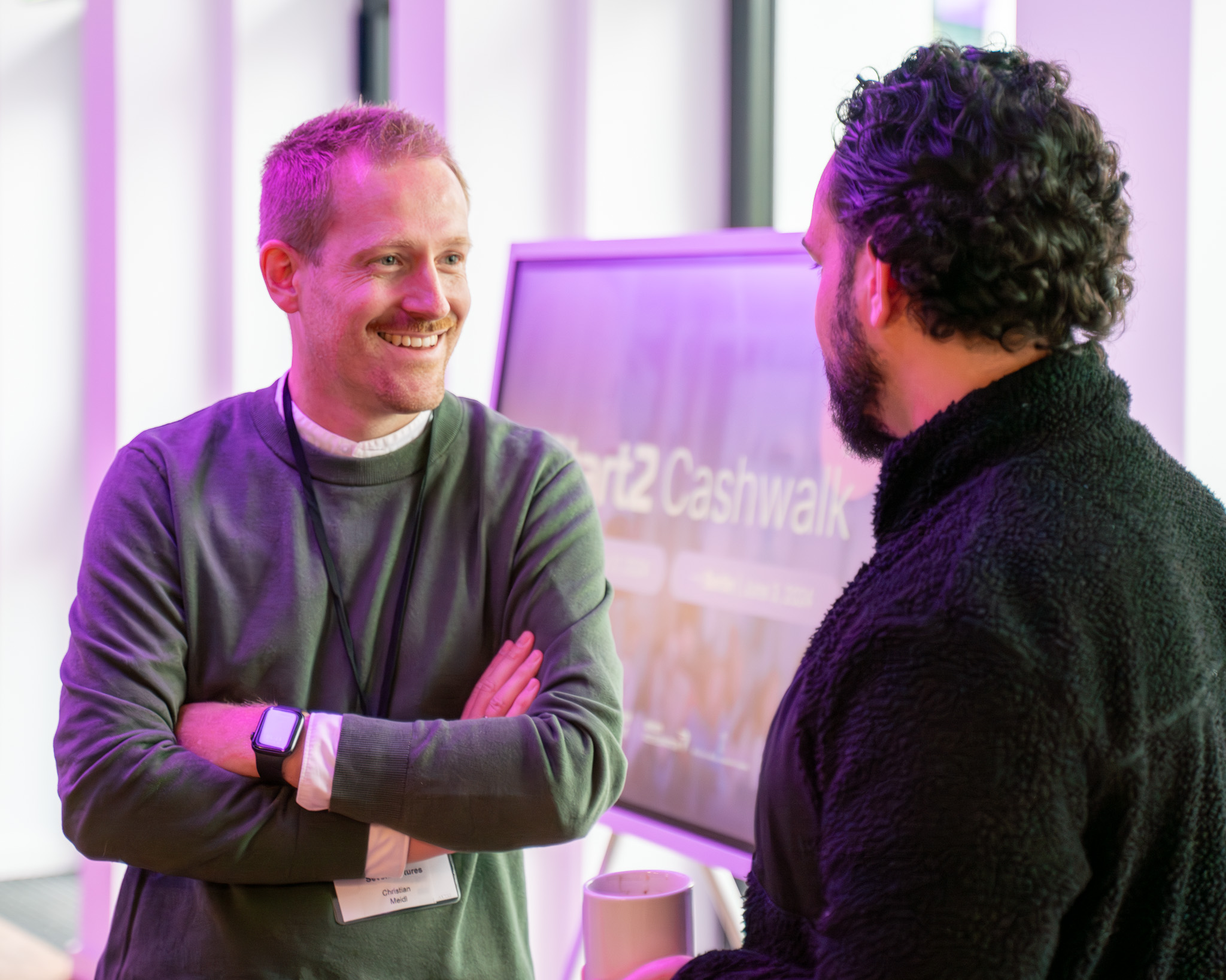Two people in conversation at a Start2 Cashwalk event