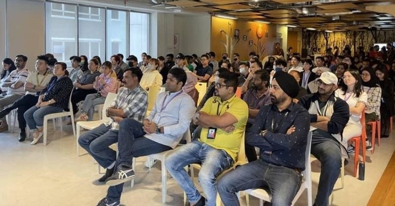 Employees seated together at a Startek Malaysia town hall in 2023