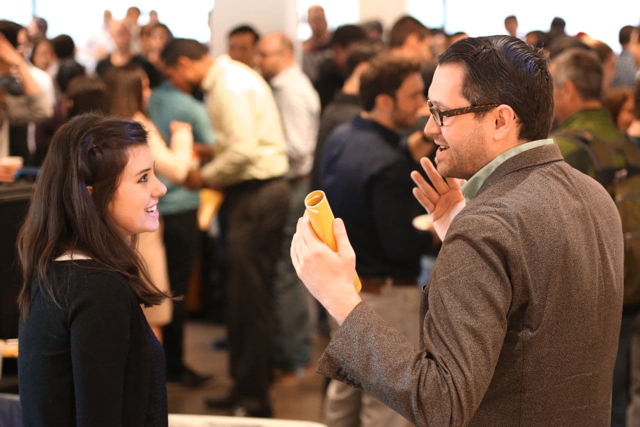 Participants talk at a Startup Institute training and networking event in New York.