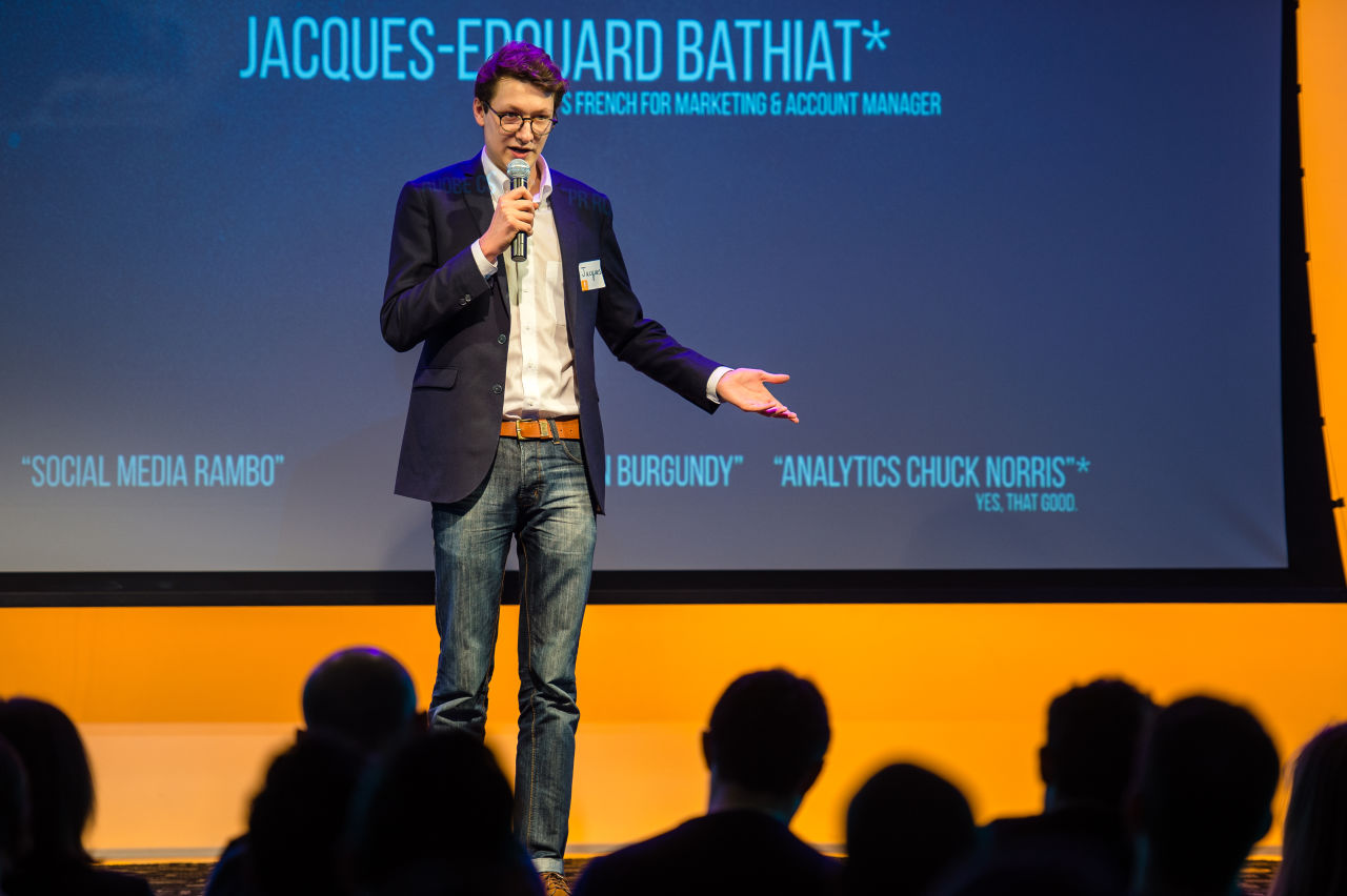 A participant presents his skills and career goals on stage at a New York Startup Institute event.