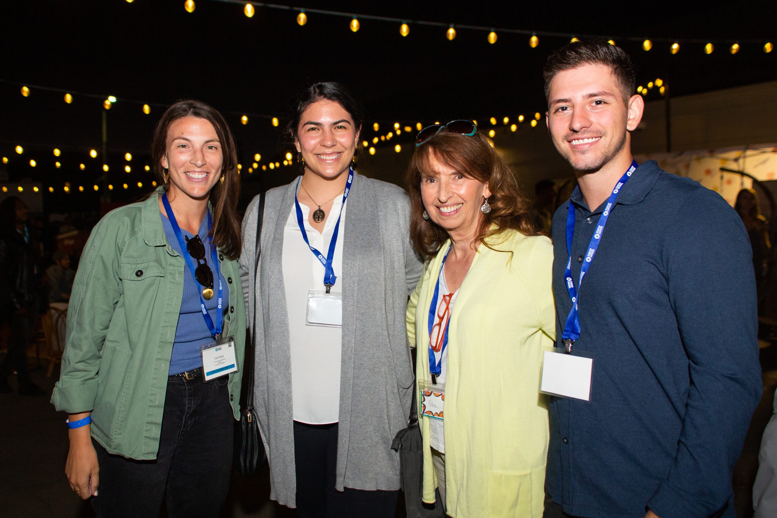 Four participants wearing event badges at a Startup San Diego gathering